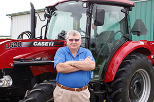 Jake Rendleman pictured with 1949 Farmall