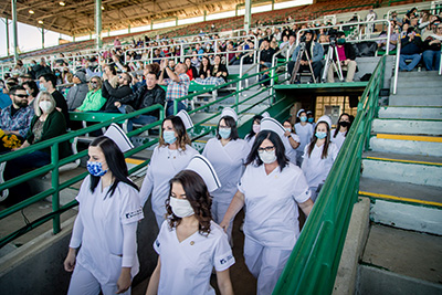 Nursing students walking in at pinning ceremony