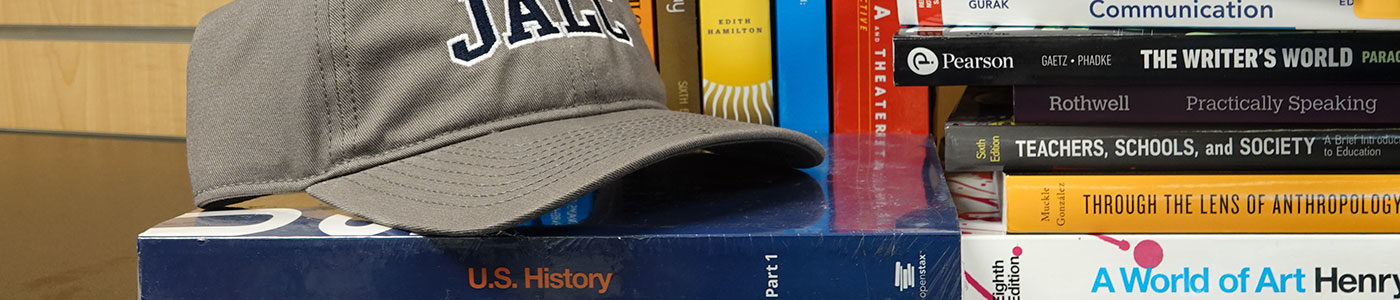 Communication, Humanities, and Social Science books and JALC hat