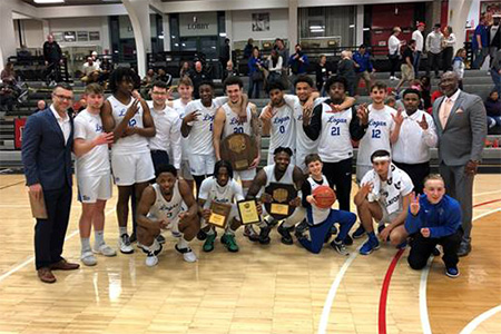 John A. Logan College Men's Basketball team with awards after winning region 24.