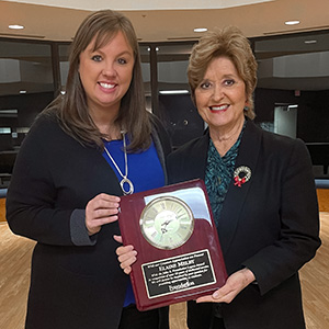 Staci Shafer and Elaine Melby showing the Legacy Award that Elaine received