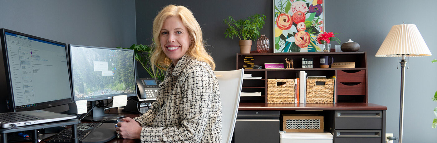 Dr. Stephanie Chaney Hartford sitting at desk