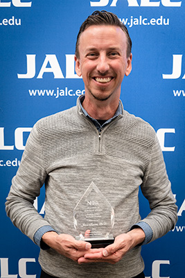 Jason Tanner with award for National Business Education Association Post Secondary Teacher of the Year