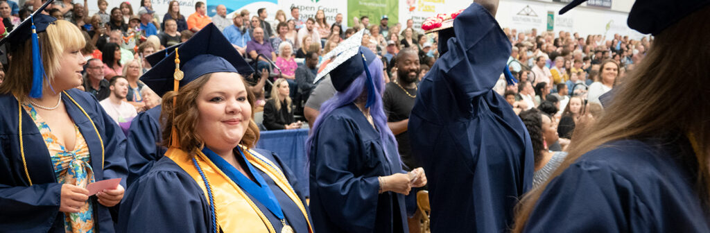 Students and crowd at graduation