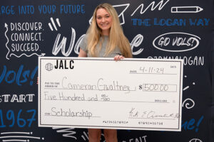 Cameran Gwaltney with scholarship check for JALC