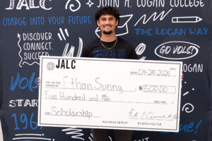 Ethan Sunny with scholarship check for JALC
