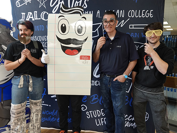 JALC College President Dr. Overstreet poses with HUHY and students during Splash & A Slice event.