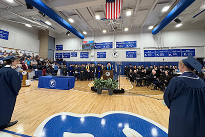 Provost Stephanie Hartford addresses crowd at 2025 Commencement ceremony.