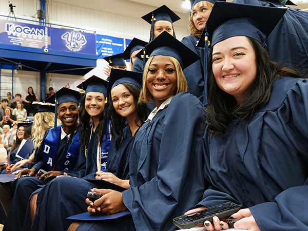 Group of students pose together at JALC graduation.