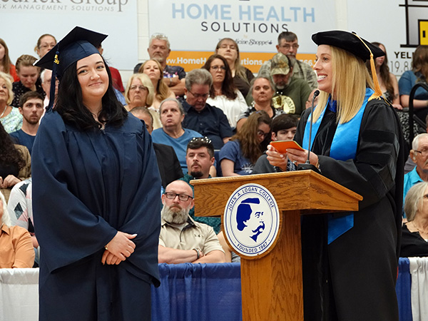 Provost Stephanie Hartford at graduation with student.