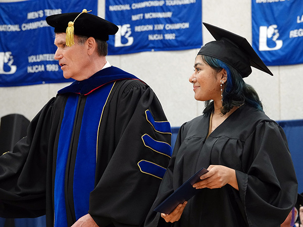 College President Dr. Kirk Overstreet with Student Trustee Zoren Anako Mohamad Ali at graduation.