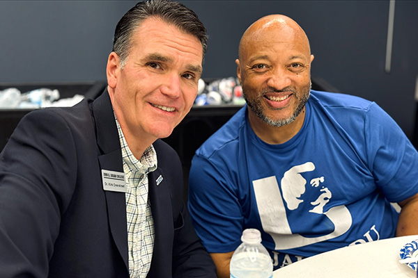 JALC President Dr. Overstreet with employee David McCroy at Juneteenth event at John A. Logan College.