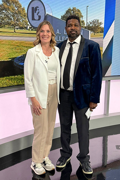 Cordy Love, the Assistant Director of Professional Development and Organizational Culture at JALC, stands next to Rachel Gartner for a WSIL News 3 interview about JALC's Juneteenth event.