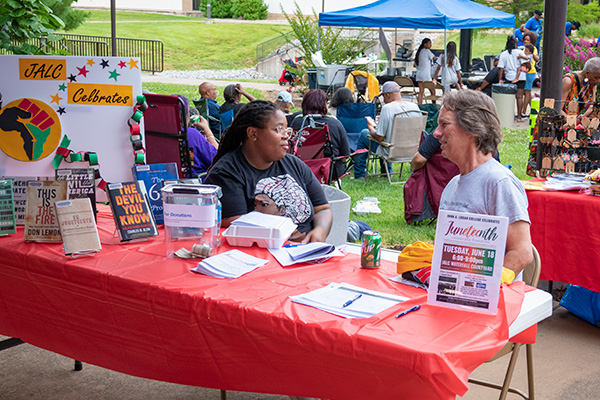 Group of people at Juneteenth celebration in the Waterfall Courtyard at John A. Logan College.