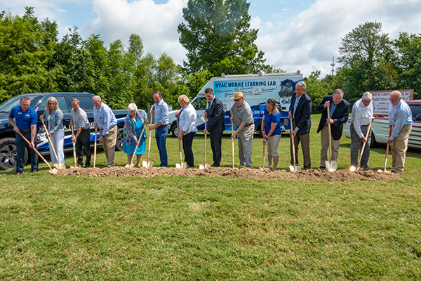 People associated with the new CTE Center hold shovels for the groundbreaking event.