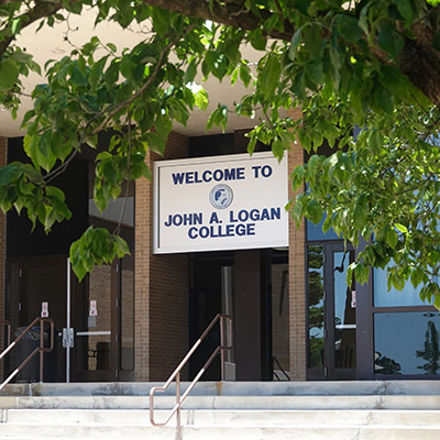 Entrance to John A. Logan College with sign that says WELCOME TO JOHN A. LOGAN COLLEGE.