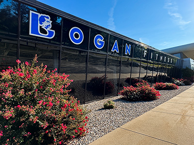 Outside Logan Fitness windows and sidewalk.