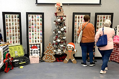 Two patrons looking at crafts at the Autumnfest Arts and Crafts show at John A. Logan College.