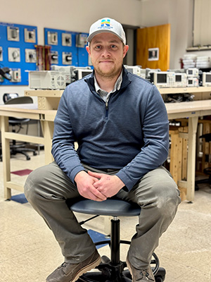 Nathan Sullivan sitting in a chair.