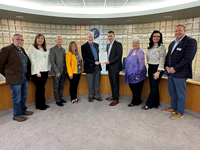 In Board Room: Sam Jones, Mayor of Crainville and Cluck family friend; Staci Shafer, Assistant Vice President of Advancement and Executive Director of the John A. Logan College Foundation; Frank Cluck, Founder of the FDC Foundation; Cindy Heynen, daughter of Frank and Dorthy Cluck; John Doyle, President of the FDC Foundation; Dr. Kirk Overstreet, President of JALC; Dr. Susan LaPanne, Vice President of Business Services and CFO of John A. Logan College; Amanda Throgmorton, JALC Foundation Board; Dr. Steve O’Keefe, Assistant Vice President for Marketing, Public Relations, and Communications at John A. Logan College.