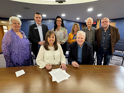 At table: Dr. Susan LaPanne, Vice President of Business Services and CFO of John A. Logan College; Dr. Kirk Overstreet, President of JALC; Amanda Throgmorton, JALC Foundation Board; Cindy Heynen, daughter of Frank and Dorthy Cluck; Frank Cluck, Founder of the FDC Foundation; Sam Jones, Mayor of Crainville and Cluck family friend; Staci Shafer, Assistant Vice President of Advancement and Executive Director of the John A. Logan College Foundation; John Doyle, President of the FDC Foundation.