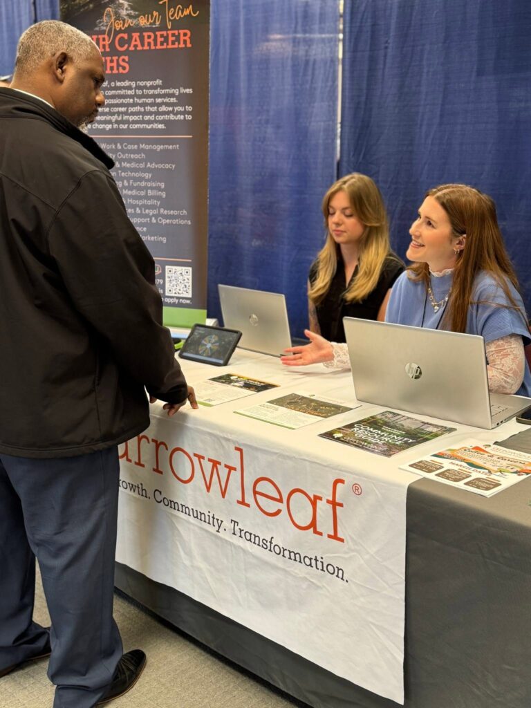 Arrowleaf speaking with a candidate at the Career Fair.