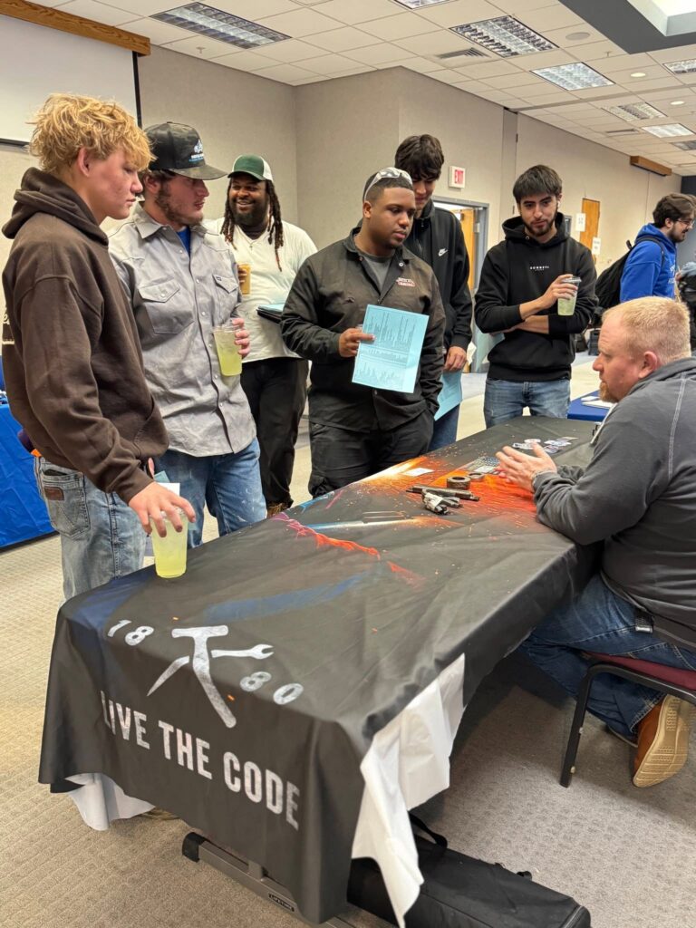 Group of students engaging with an employer at the Career Fair.