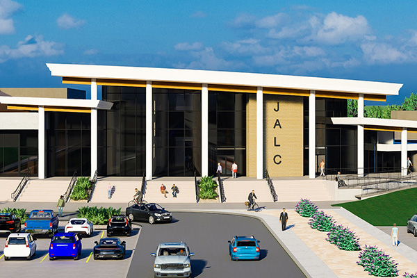 Rendering of the outside of the West Entrance for John A. Logan College. Entrance has large windows with stairs and ramp in front.
